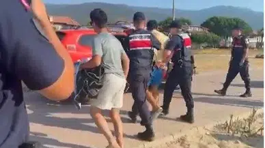 Kuşadası sahilinde yakalanan şüphelinin çantasından servet çıktı