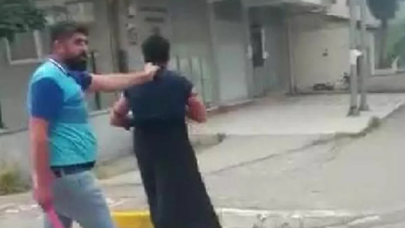 Eşini taciz ettiğini iddia ettiği adamı kadın kıyafeti giydirerek karakola götürdü