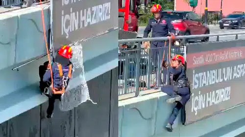 Arnavutköy'de yürekleri ağza getiren kurtarma operasyonu: Reklam panosuna sıkışan kedi kurtarıldı