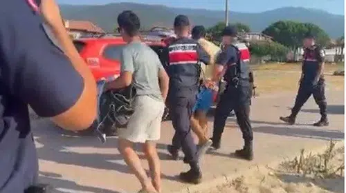 Kuşadası sahilinde yakalanan şüphelinin çantasından servet çıktı