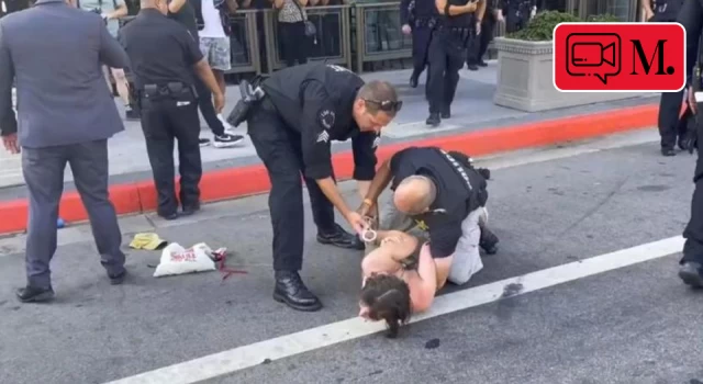Biden'ı protesto eden kadına polis sert müdahale etti
