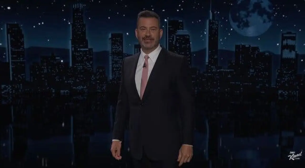 Jimmy Kimmel onstage in a suit.